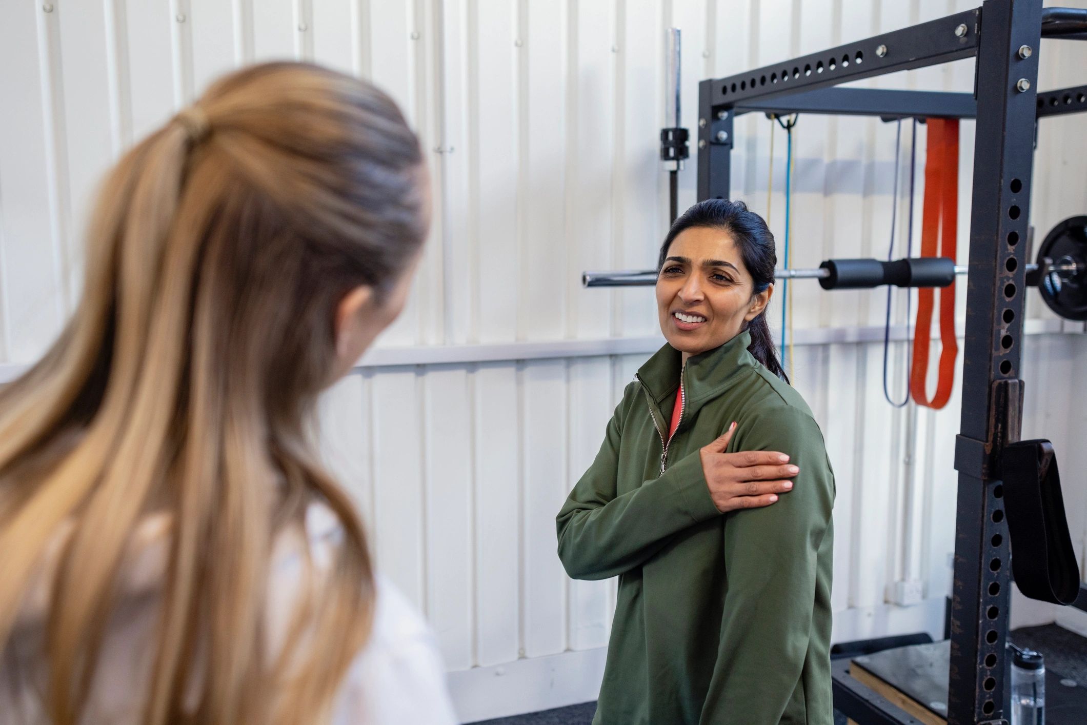 Client receiving guidance for arm discomfort