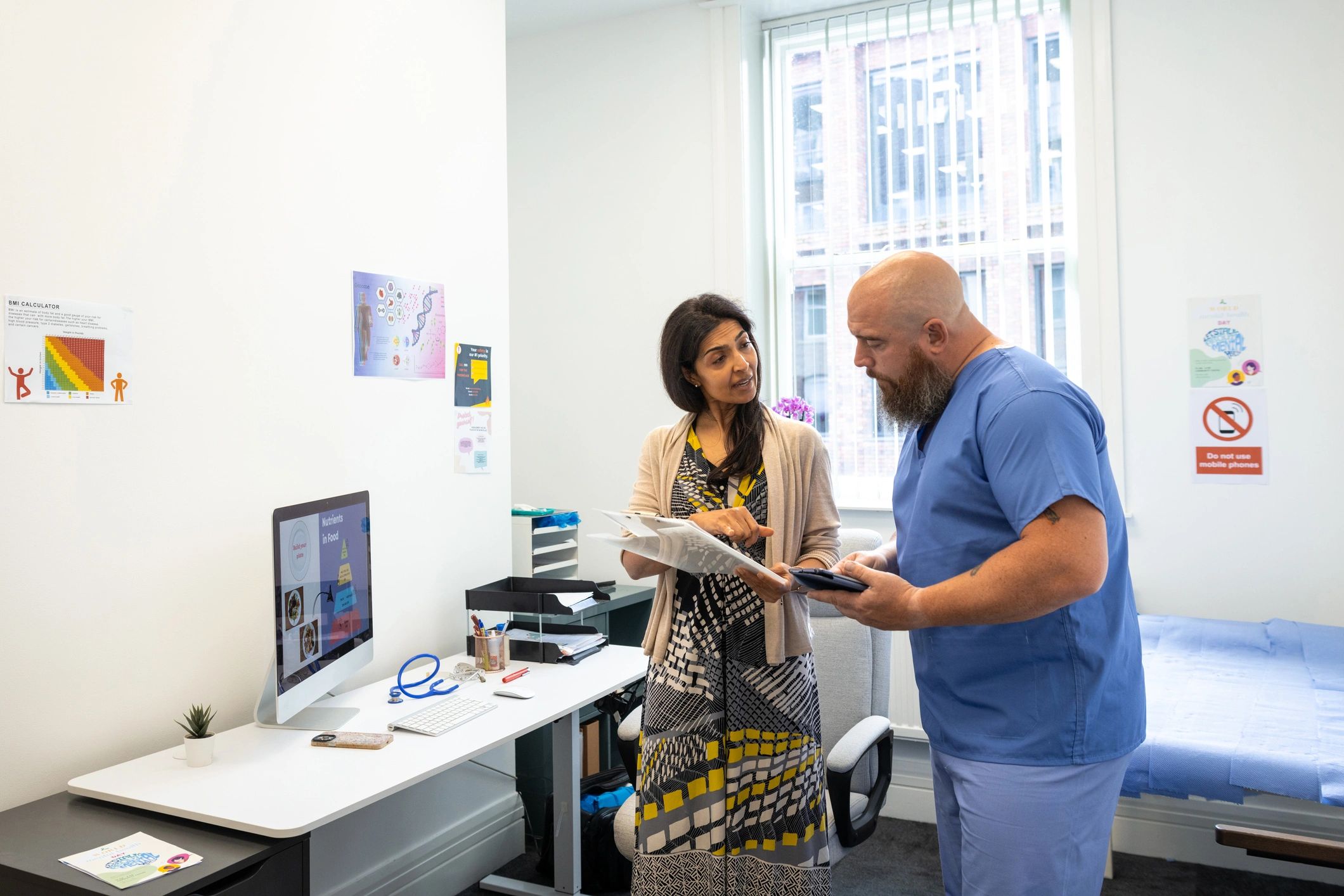 Healthcare professionals discussing patient care in a clinic